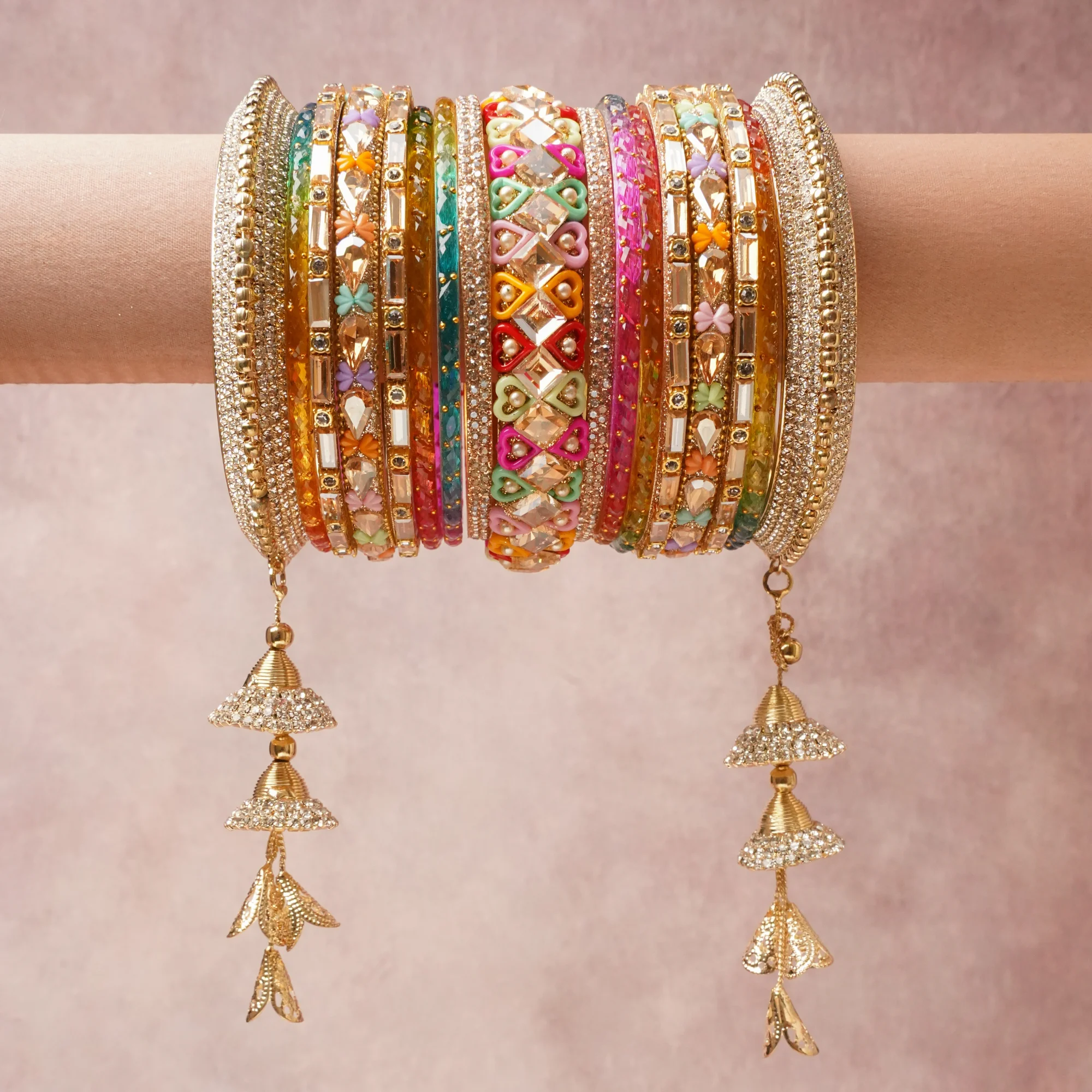 A majestic Multi colour set, complemented by Clear, Champagne, Teal, Amber, Magenta, Deep Red, Mint Green, Bright Pink, Yellow, Sky Blue, Lavender, White featuring Gold-plated Metal, Glass, Crystals, Enamel, Simulated Pearls.
Rich, ceremonial, and designed to be passed through generations.